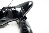 Black patent leather oxford shoes