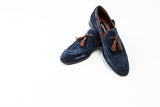 Navy blue suede loafers with brown leather tassels