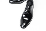Patent leather black wholecut brogue shoes