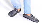 Grey patent leather driving moccasins with leather piping and bow tassels